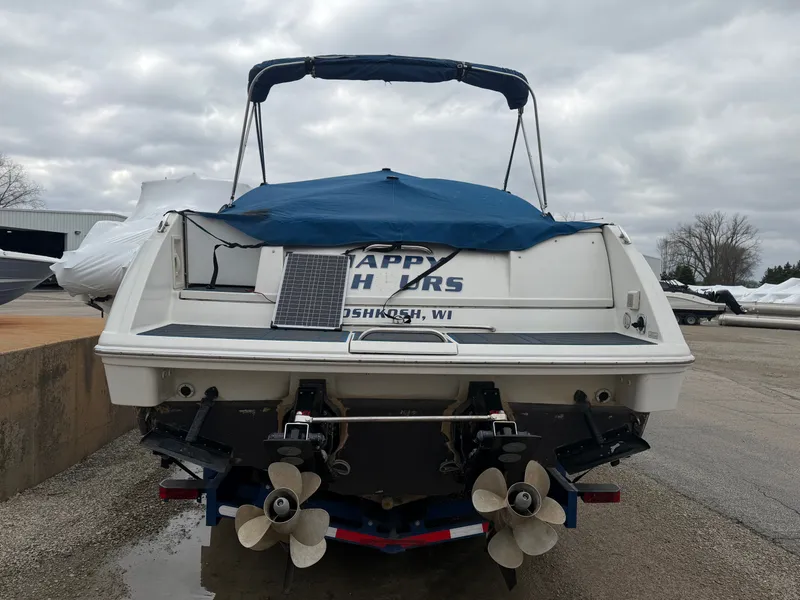 Slide: The Image of Rear view of a 2002 Formula 330 Sun Sport boat with cover. - 4
