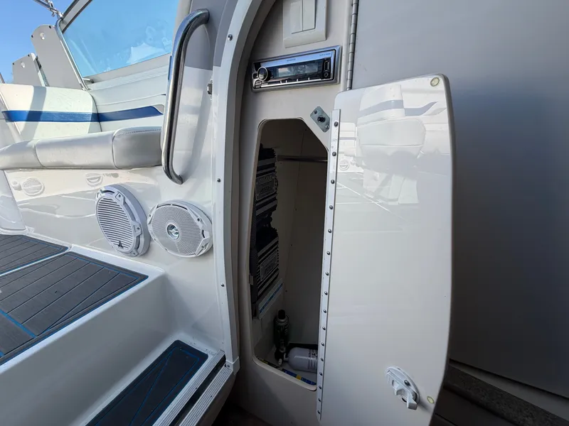 Slide: The Image of Interior of a 2002 Formula 330 Sun Sport boat with speakers. - 44