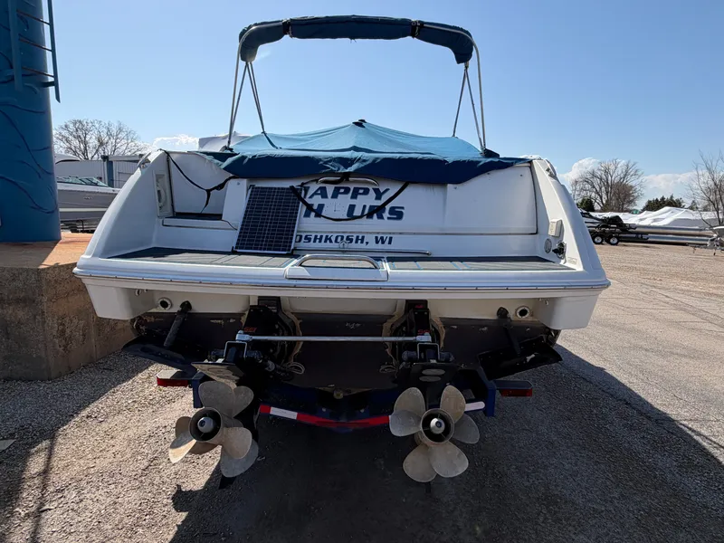 Slide: The Image of Rear view of a 2002 Formula 330 Sun Sport boat outdoors. - 5