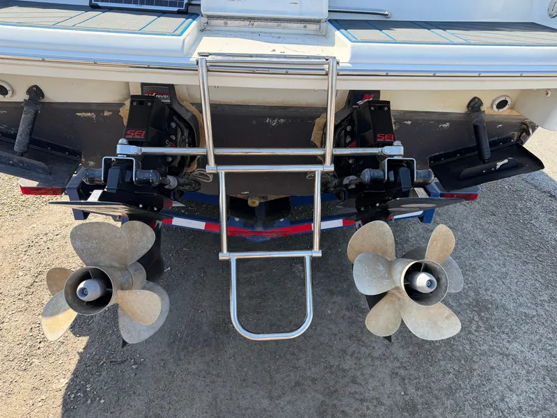 Slide: The Image of Rear view of a 2002 Formula 330 Sun Sport boat with dual engines. - 8