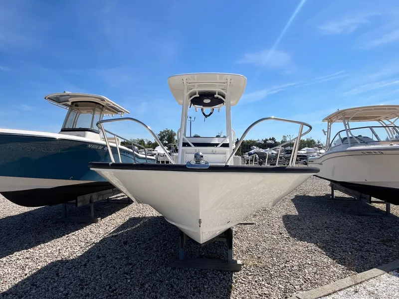 Slide: The Image of 2021 Boston Whaler 210 Montauk boat on gravel lot. - 2