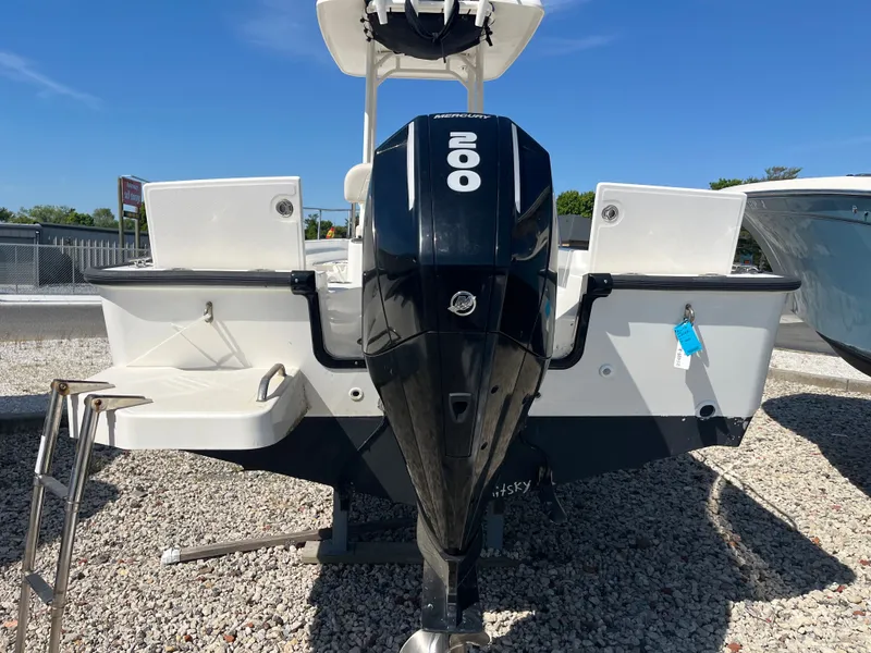 Slide: The Image of Rear view of a 2021 Boston Whaler 210 Montauk with 200 HP engine. - 3