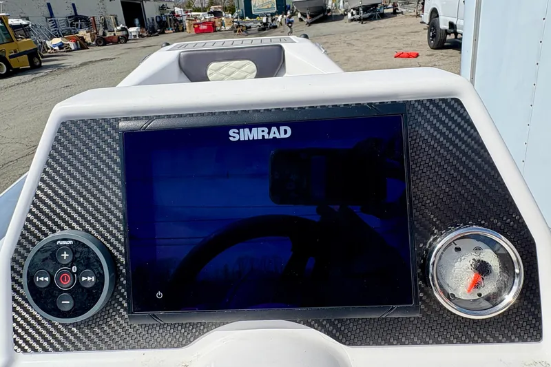 Slide: The Image of 2024 Highfield Sport 360 dashboard with Simrad display and Fusion controls. - 13