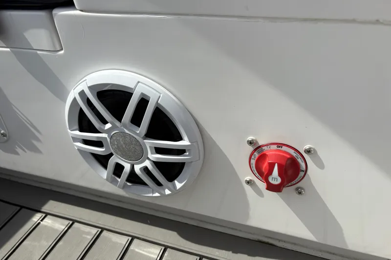 Slide: The Image of 2024 Highfield Sport 360 boat speaker and control knob on deck. - 14