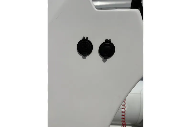 Slide: The Image of Close-up of 2024 Highfield Sport 360 boat's dual black ports on white surface. - 15
