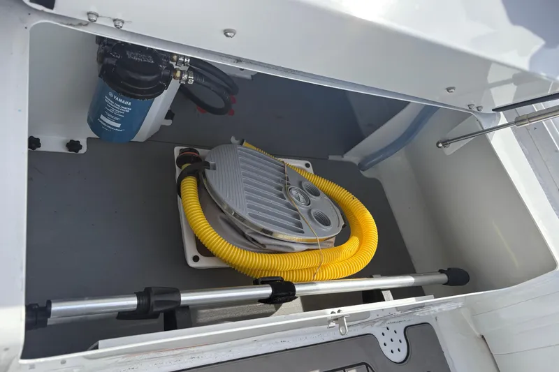 Slide: The Image of 2024 Highfield Sport 360 storage compartment with equipment and yellow hose. - 17