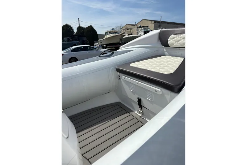 Slide: The Image of 2024 Highfield Sport 360 boat interior with cushioned seating and sleek design. - 18