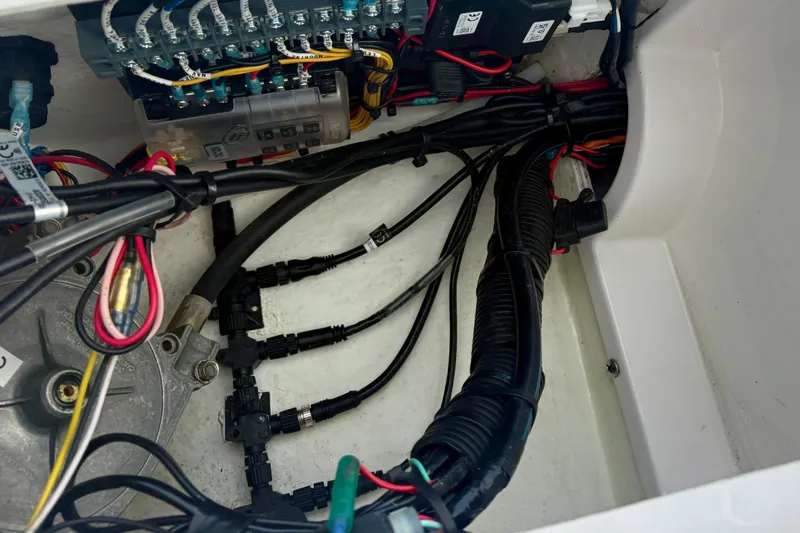 Slide: The Image of Electrical wiring and components inside a 2024 Highfield Sport 360 boat. - 19
