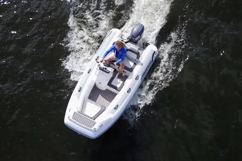 Slide: The Image of Manufacturer Provided Image: 2024 Highfield Sport 360 inflatable boat cruising on water. - 22