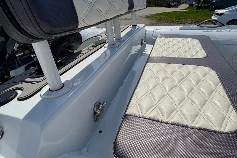 Slide: The Image of 2024 Highfield Sport 360 boat interior with quilted seating and sleek design. - 5