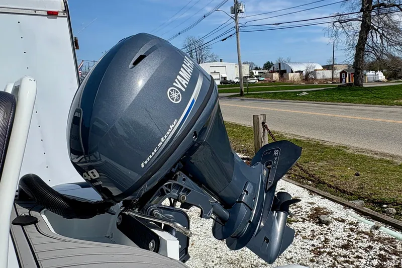 Slide: The Image of 2024 Highfield Sport 360 with Yamaha four-stroke outboard motor, parked outdoors. - 8
