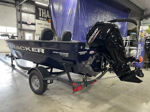 Slide: The Image of 2026 Tracker Pro Guide V-16 SC boat in a workshop. - 10