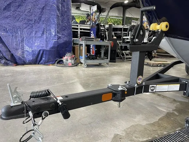 Slide: The Image of Trailer of a 2026 Tracker Pro Guide V-16 SC boat. - 13