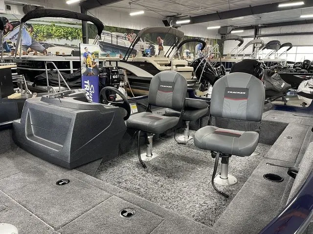 Slide: The Image of Interior of 2026 Tracker Pro Guide V-16 SC with two seats. - 15