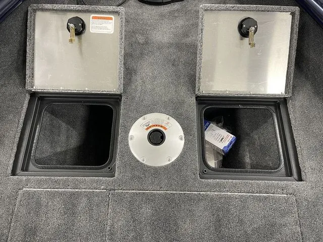 Slide: The Image of Interior of 2026 Tracker Pro Guide V-16 SC with storage compartments. - 21