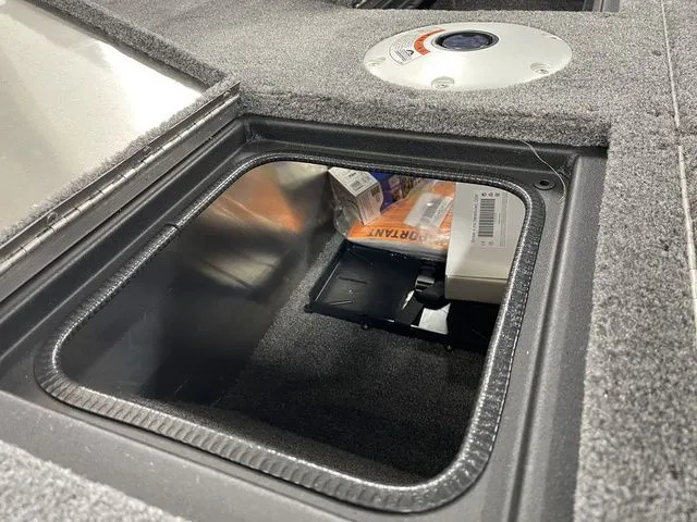 Slide: The Image of Interior view of Tracker Pro Guide V-16 SC 2026 storage compartment. - 22