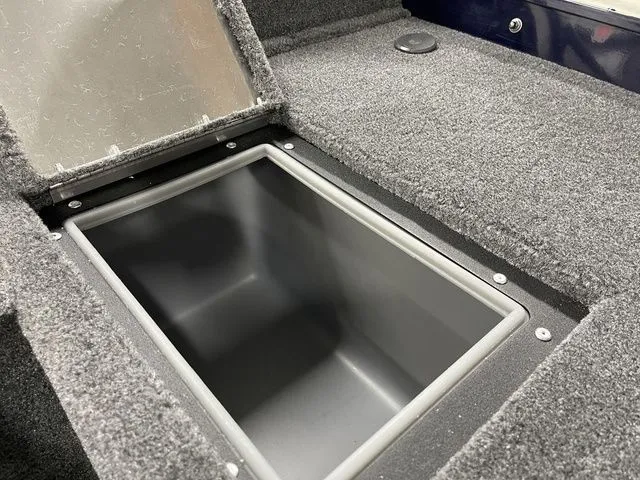 Slide: The Image of 2026 Tracker Pro Guide V-16 SC carpeted storage compartment. - 32