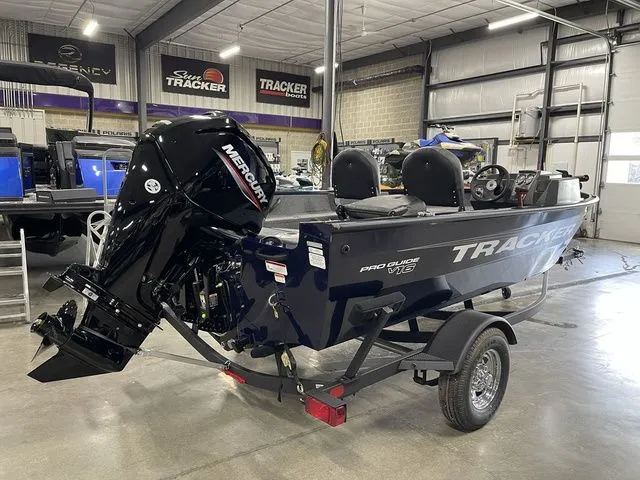 Slide: The Image of 2026 Tracker Pro Guide V-16 SC boat in a workshop. - 4