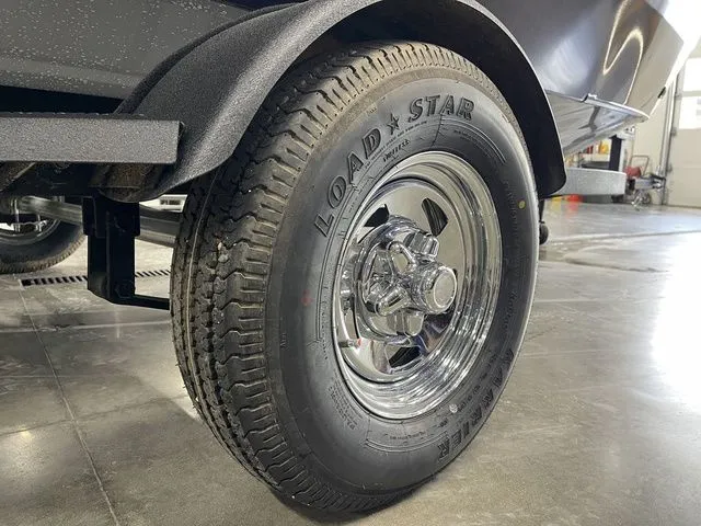 Slide: The Image of Close-up of a 2026 Tracker Pro Guide V-16 SC boat trailer. - 6