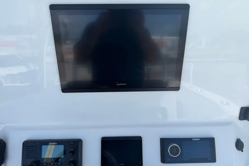 Slide: The Image of Dashboard of 2023 Contender 28 Tournament boat with Garmin and Fusion electronics. - 12