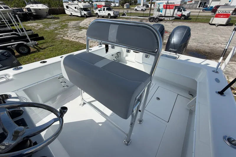 Slide: The Image of 2023 Contender 28 Tournament boat interior with dual engines and seating. - 13