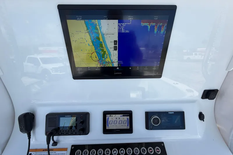 Slide: The Image of Dashboard of 2023 Contender 28 Tournament boat with navigation and control systems. - 16