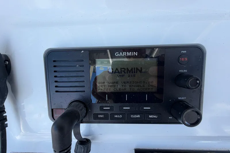 Slide: The Image of Garmin VHF 215 radio on 2023 Contender 28 Tournament boat dashboard. - 17