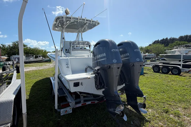 Slide: The Image of 2023 Contender 28 Tournament boat with dual Yamaha 200 engines on a trailer. - 23