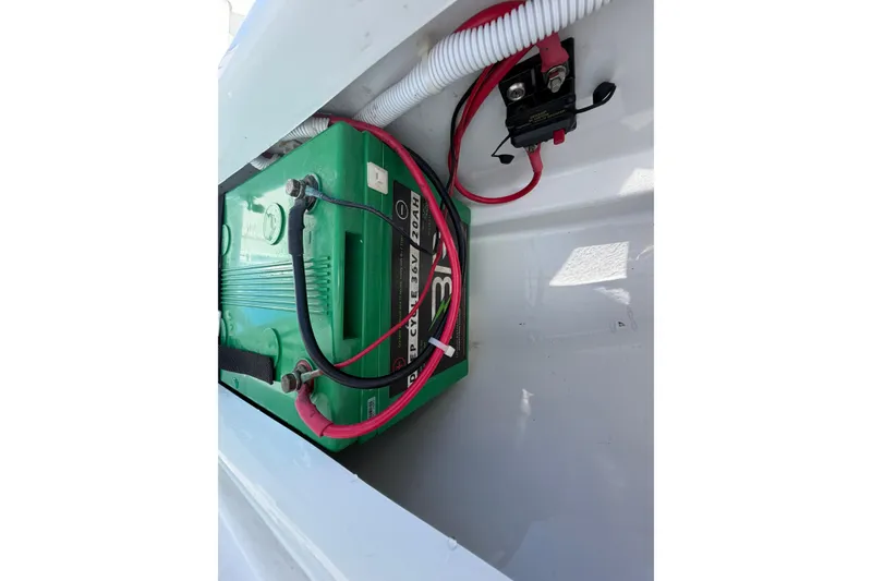 Slide: The Image of Battery compartment of 2023 Contender 28 Tournament boat with wiring connections. - 28