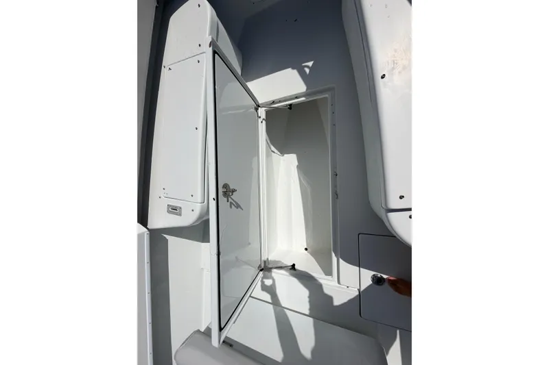 Slide: The Image of 2023 Contender 28 Tournament boat interior with open storage compartment. - 29