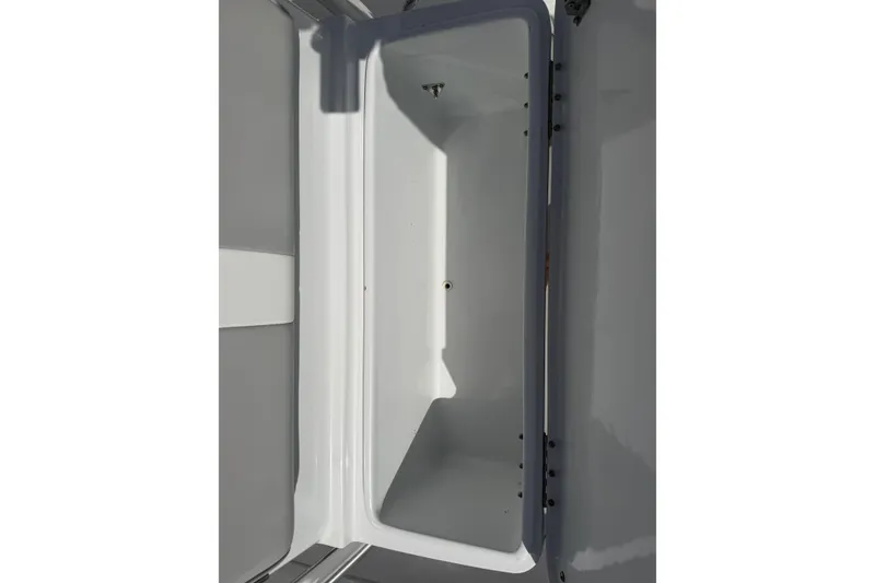 Slide: The Image of 2023 Contender 28 Tournament boat storage compartment, open and empty. - 31