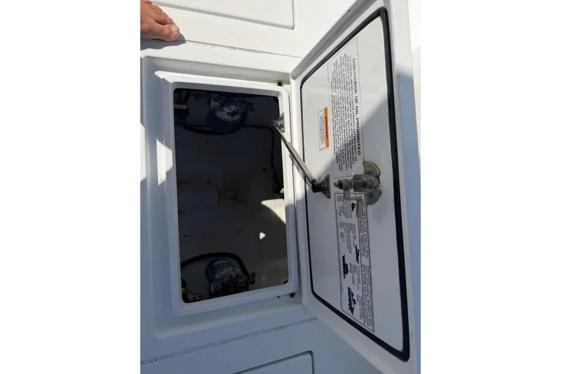 Slide: The Image of Open hatch on 2023 Contender 28 Tournament boat, showing internal compartment details. - 37