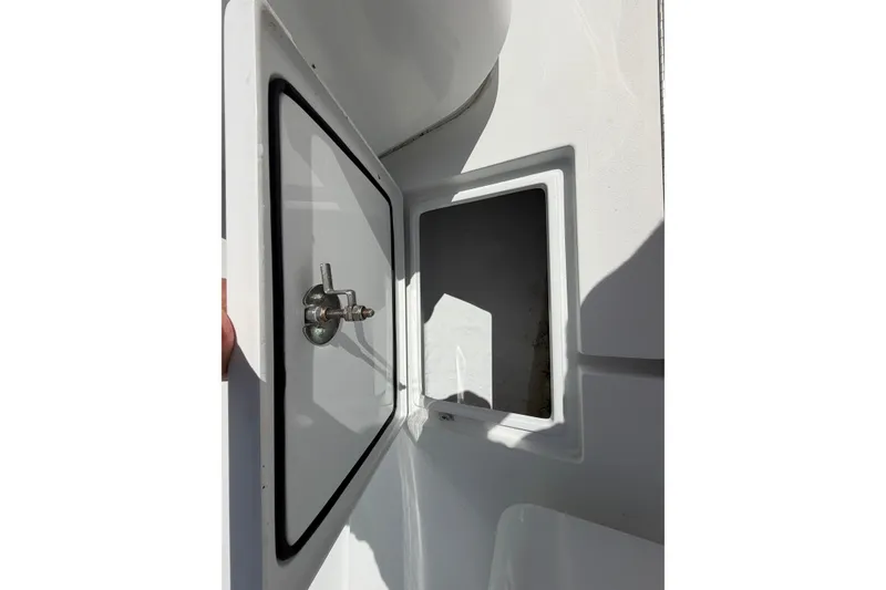 Slide: The Image of Open storage compartment on 2023 Contender 28 Tournament boat, showcasing interior space. - 7