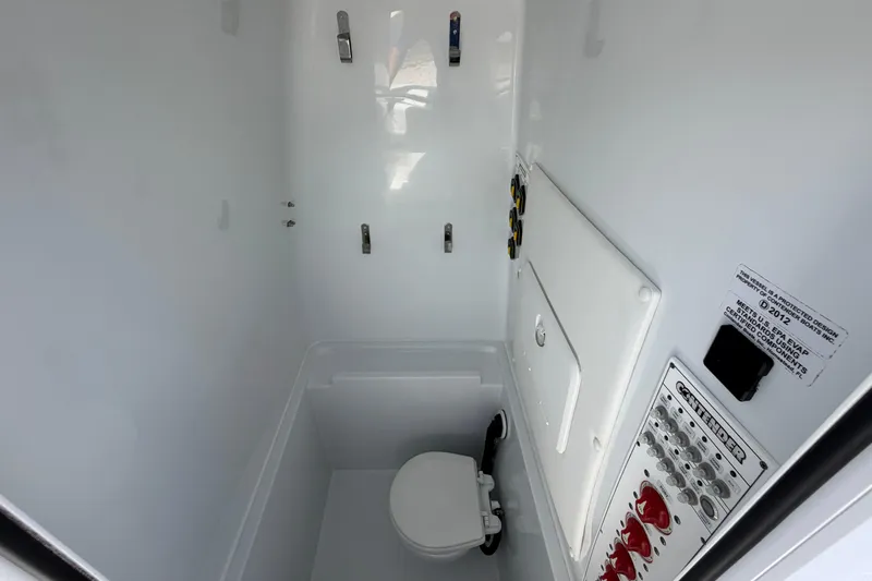 Slide: The Image of Interior of 2023 Contender 28 Tournament boat's compact marine bathroom. - 9