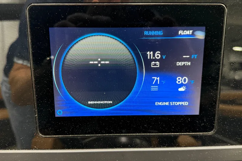 Slide: The Image of Display screen of 2025 Bennington M Quad Bench 24 MFB showing engine status and environmental data. - 11
