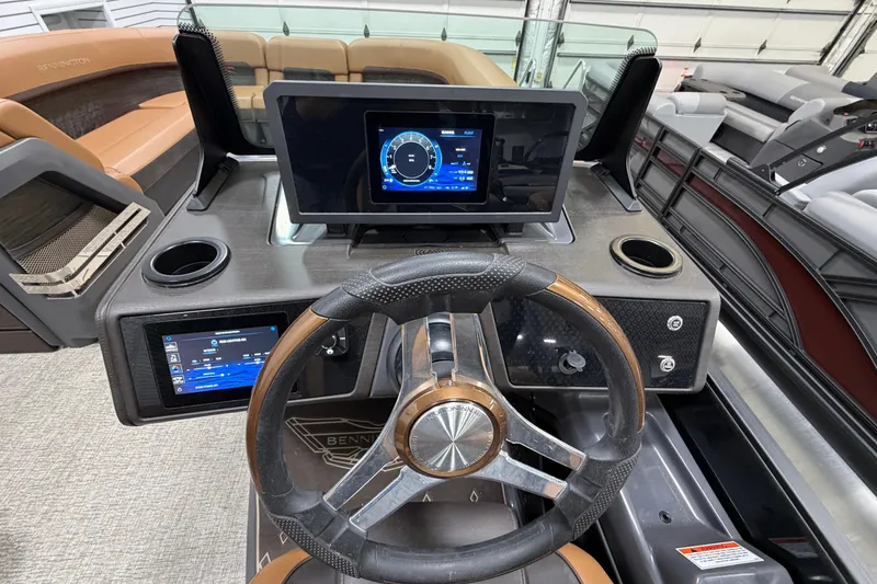 Slide: The Image of Dashboard of 2025 Bennington M Quad Bench 24 MFB with modern controls and displays. - 14