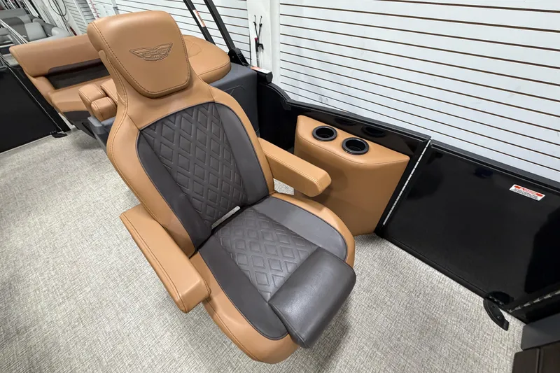 Slide: The Image of Luxurious seating on 2025 Bennington M Quad Bench 24 MFB with diamond-stitched upholstery and cup holders. - 16