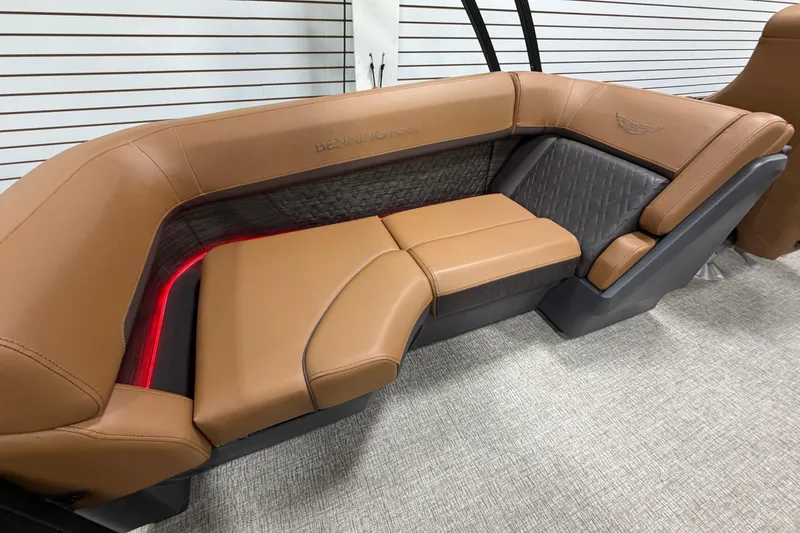Slide: The Image of Luxurious Bennington M Quad Bench 24 MFB 2025 with tan leather seating and ambient lighting. - 17