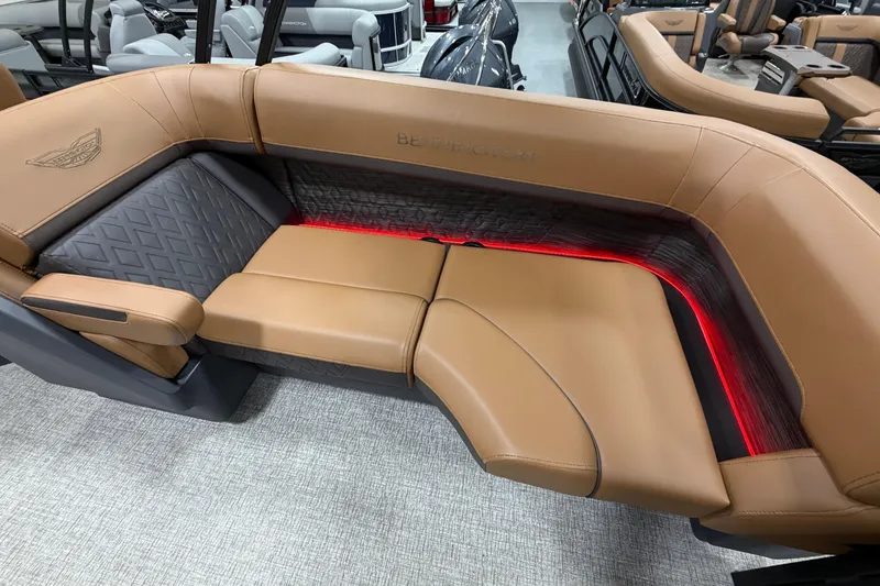 Slide: The Image of Luxurious Bennington M Quad Bench 24 MFB 2025 with tan leather seating and ambient lighting. - 18