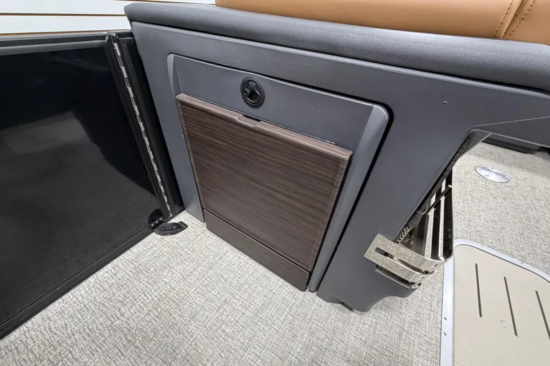 Slide: The Image of 2025 Bennington M Quad Bench 24 MFB interior detail with sleek storage compartment. - 22