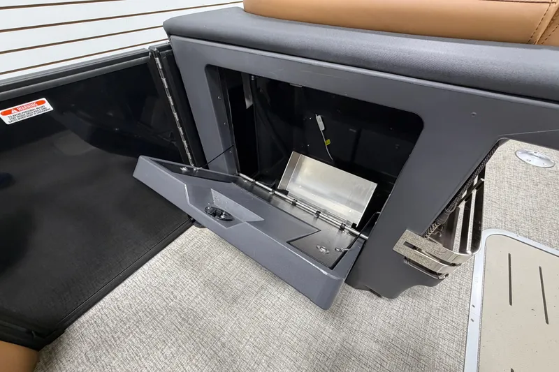 Slide: The Image of Bennington M Quad Bench 24 MFB 2025 interior storage compartment open, showcasing sleek design. - 23