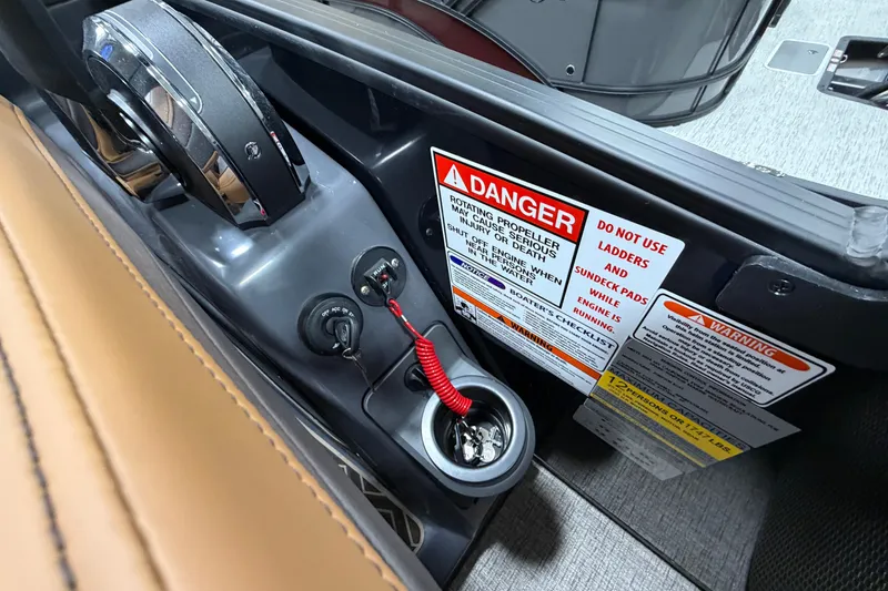 Slide: The Image of Control panel of 2025 Bennington M Quad Bench 24 MFB with safety warnings. - 26