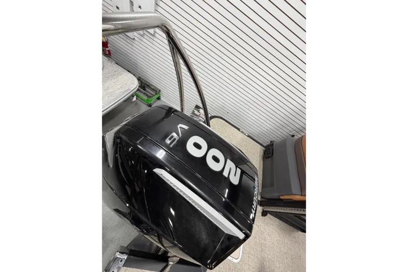 Slide: The Image of 2025 Bennington M Quad Bench 24 MFB boat engine in showroom display. - 6