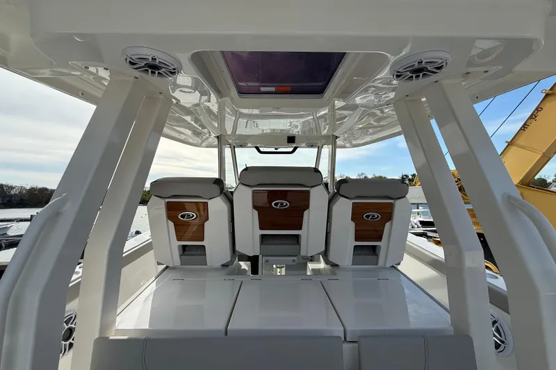 Slide: The Image of 2026 Pursuit S 358 Sport boat interior with sleek seating and modern design. - 10