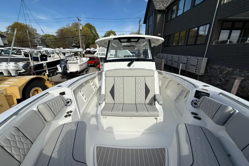 Slide: The Image of 2026 Pursuit S 358 Sport boat interior with luxurious seating and modern design. - 8