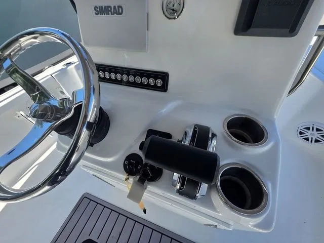 Slide: The Image of 2024 Tidewater 1910 Bay Max helm with steering wheel and controls. - 15