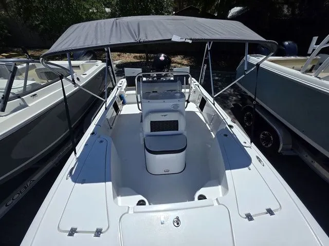 Slide: The Image of 2024 Tidewater 1910 Bay Max boat with canopy in harbor. - 22