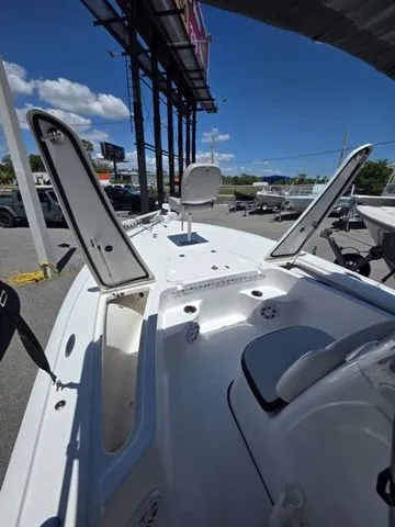 Slide: The Image of 2024 Tidewater 1910 Bay Max boat with open storage compartments. - 24