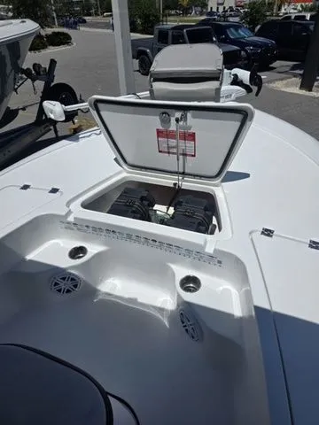 Slide: The Image of 2024 Tidewater 1910 Bay Max boat with open storage hatch. - 26