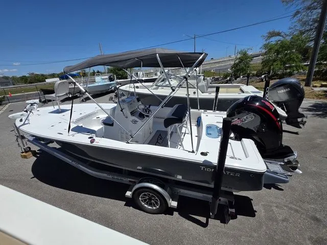 Slide: The Image of 2024 Tidewater 1910 Bay Max boat on trailer outdoors. - 3